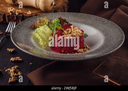 Warm beetroot, nuts and herbs salad Stock Photo