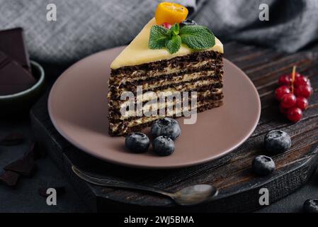 Chocolate vanilla cake with berries on plate Stock Photo