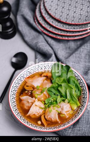 Soup gyoza, dumplings with bok-choy in clear soup Stock Photo