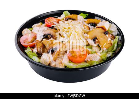Warm salad with roasted chicken meat, vegetables and mushrooms Stock Photo