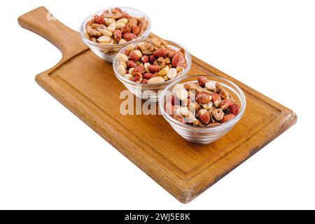 Assorted nuts in a glass bowls on wooden Stock Photo