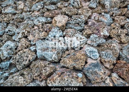 Coral wall made of blocks of textured and unique coral rocks at Malindi Beach in Kenya Stock Photo