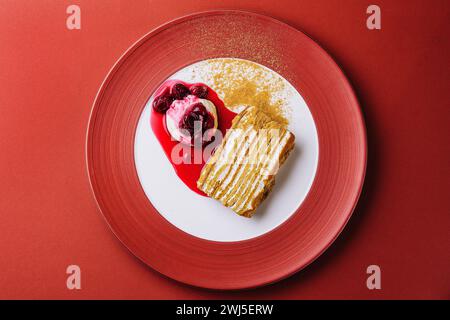 Napoleon cake with vanilla ice cream with cherry jam Stock Photo