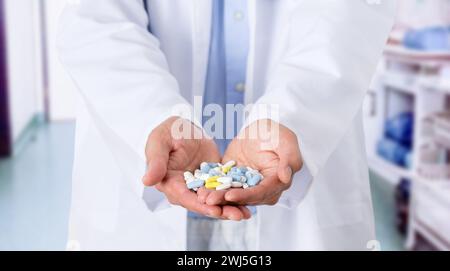 Closeup shot of an unidentifiable male doctor holding a variety of pills in her hands Stock Photo