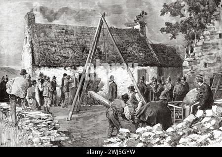 Land League Huts. Eviction of an Irish farmer by English police, County Carlow. Republic of Ireland. Europe. Three Months In Ireland By Miss Marie Anne De Bovet (1855 - 1935) Limerick and the Clare Coast 1889, Le Tour du Monde 1890 Stock Photo