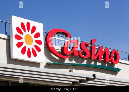 Lyon, France - May 21, 2020: Casino supermarket logo on a wall. Casino is a hypermarket and supermarket chain based in Saint Etienne, France Stock Photo