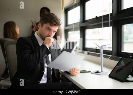 Young businessman and diverse group of business people working together in office, Brainstorming on how to use natural energy fr Stock Photo