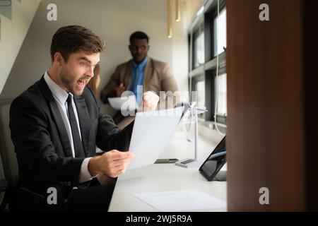 Young businessman and diverse group of business people working together in office, Brainstorming on how to use natural energy fr Stock Photo