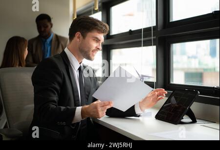 Young businessman and diverse group of business people working together in office, Brainstorming on how to use natural energy fr Stock Photo