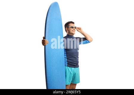 Young man with sunglasses and a surfing board isolated on white background Stock Photo