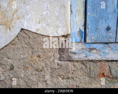The old building's side frames are starting to erode, the plaster is dangerously brittle Stock Photo