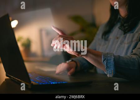 Computer Security Concept With Overlay Projected Onto Screen Of Woman Using Laptop Stock Photo