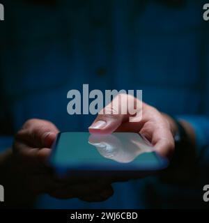 Close Up Of Woman Using Mobile Phone Using Biometrics To Unlock Device Stock Photo