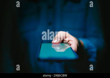 Close Up Of Woman Using Mobile Phone Using Biometrics To Unlock Device Stock Photo