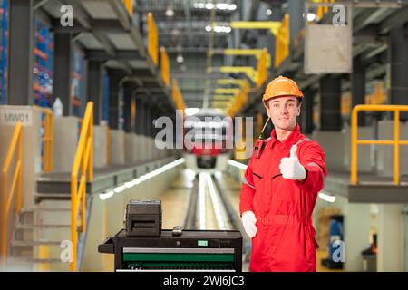 Portrait of engineer using repair tools of the electric train industry There is an electric train in the train repair factory as Stock Photo
