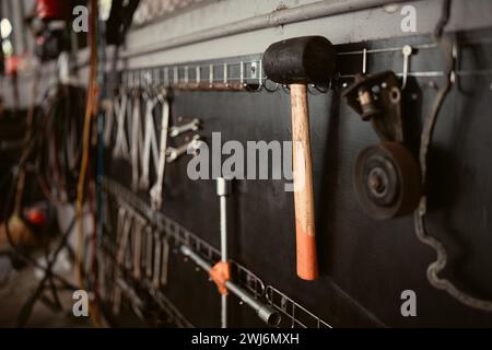 Handyman tools in car repair shop, Close-up of hammer and wrench Stock Photo