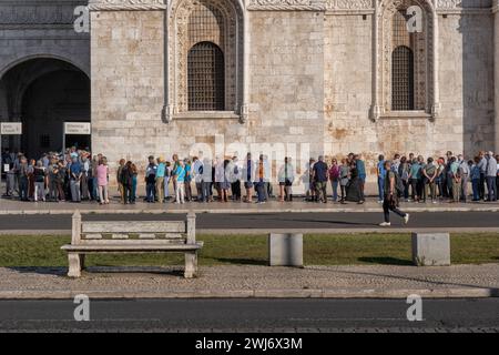 People waiting in long queue to ticket office at Church of Santa Maria de Belem of Jeronimos Monastery in Lisbon, Portugal. Stock Photo