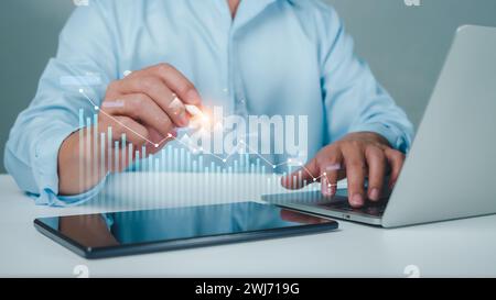 Stock market, Business growth, progress or success concept. Businessman or trader is showing a growing virtual hologram stock, invest in trading. Stock Photo