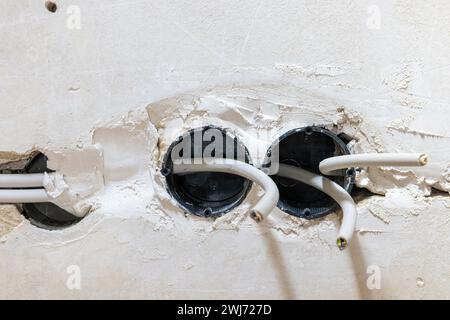 Electrical wiring in the old house flush-mounted Stock Photo