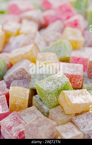 Multicolour cubes of rahat lokum, traditional Turkish dessert, abstract food background Stock Photo