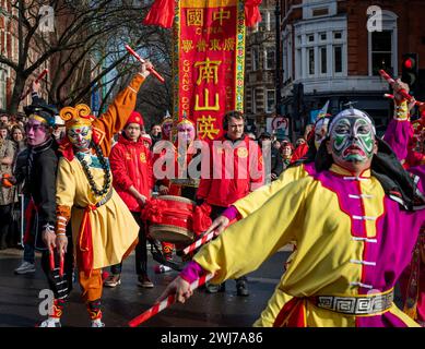 London. UK- 02.11.2024. A dance ground performing a Chinese folk dance in the Chinese New Year celebration parade in China Town. Stock Photo