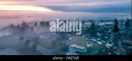 Residential Homes in a Suburban City Neighborhood. Foggy Morning Sunrise. New Westminster, Vancouver, BC, Canada. Stock Photo