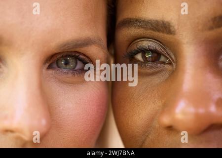 Close Up Beauty Portrait Showing Eyes Of Two Smiling Mature Women Against Natural Background Stock Photo