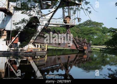 The last abandoned tin mining dredger during British colonial now display in Tanjung Tualang, Batu Gajah, Perak, Malaysia - Malayan Tin Dredging (MTD) Stock Photo