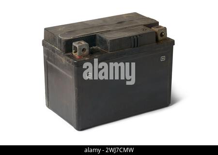 old discarded motorcycle battery, used lead acid battery isolated on white background, contain lead, sulfuric acid and other toxic chemicals Stock Photo
