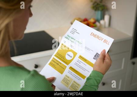 Close Up Of Woman Opening Euro Energy Bill During Cost Of Living Crisis Stock Photo