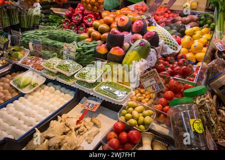Merchandise of a greengrocer in the old Abaceria Central Market of Barcelona Stock Photo