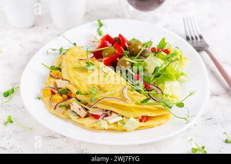 Healthy breakfast.Quesadilla with omelette, chicken fillet, corn and fresh salad. Keto, ketogenic lunch. Stock Photo