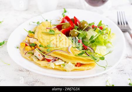 Healthy breakfast.Quesadilla with omelette, chicken fillet, corn and fresh salad. Keto, ketogenic lunch. Stock Photo