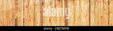 Wide wooden wall with vertical boards texture. Stock Photo