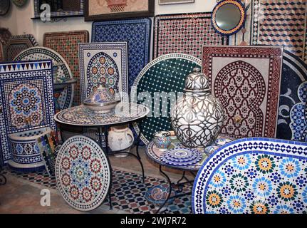 Tabletops, wall panels, fountains with a traditional Moroccan pattern of multi-colored mosaics. Traditional moroccan souvenirs, souk in Essaouira, Mor Stock Photo