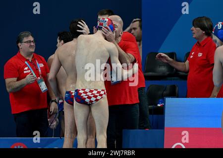 Doha, Qatar. 13th Feb, 2024. Players of Croatia celebrates the win after the Men's Water Polo Quarterfinal match between Croatia and Serbia of the Doha 2024 World Aquatics Championships at Aspire Dome on February 13, 2024 in Doha, Qatar. Photo: David Damnjanovic/PIXSELL Credit: Pixsell/Alamy Live News Stock Photo