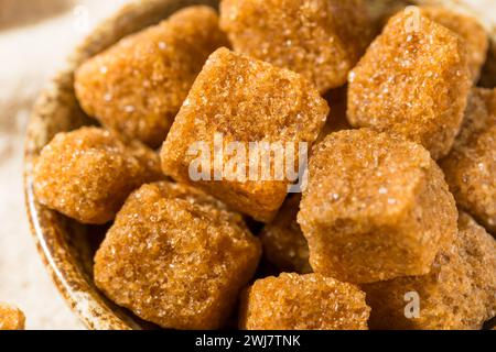 Sweet Brown Raw Sugar Cubes in a Bowl Stock Photo