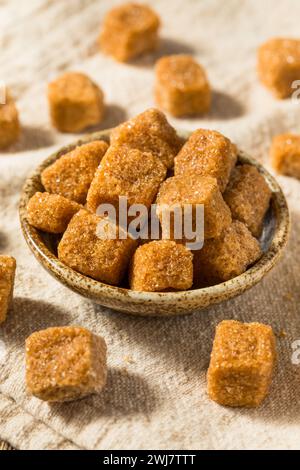 Sweet Brown Raw Sugar Cubes in a Bowl Stock Photo