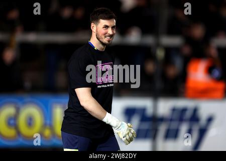 Derby County goalkeeper Joe Wildsmith wearing a 'Football v Homophobia' shirt while warming up ahead of the Sky Bet League One match at St James Park, Exeter. Picture date: Tuesday February 13, 2024. Stock Photo