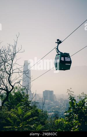 A gondola of the Teleferico cable car in Santiago de Chile on San Cristobal Mountain in the middle of the smog. Stock Photo