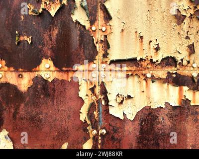Peeling paint and rust on hangar doors Stock Photo