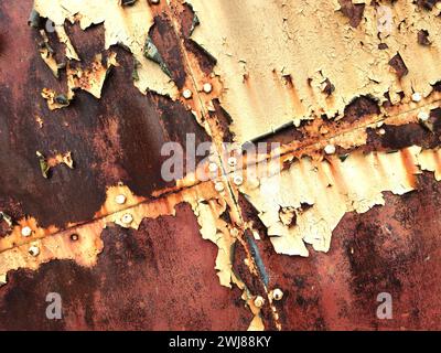 Peeling paint and rust on hangar doors Stock Photo