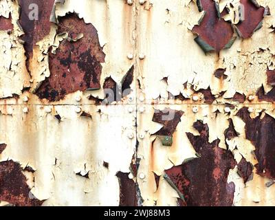Peeling paint and rust on hangar doors Stock Photo