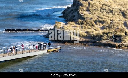 The new Lossiemouth east beach bridge during spring high tide with people unable to cross Stock Photo