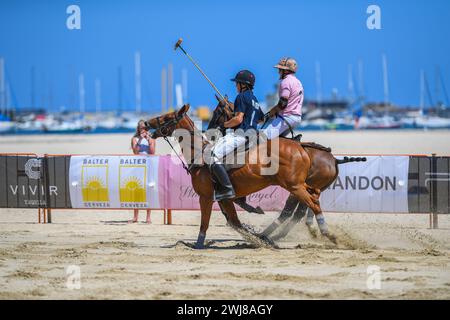 Melbourne, Australia. 10th Feb, 2024. Josh Dales (front) from Captain Baxter team and Jack 'Ruki' Baillieu (back) from Whispering Angel team are seen in action in a polo game at the Luxury Escapes Twilight beach polo 2024. (Photo by Alexander Bogatyrev/SOPA Images/Sipa USA) Credit: Sipa USA/Alamy Live News Stock Photo