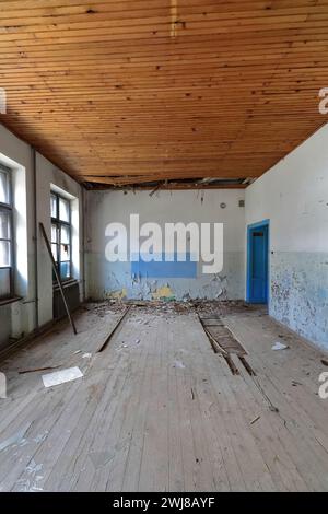 350 Old classroom remains of a ruined, abandoned former primary school full of rubble. Vevchani-North Macedonia. Stock Photo