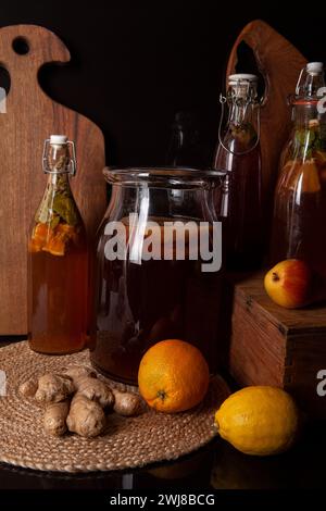 Kombucha (also tea mushroom, tea fungus, or Manchurian mushroom) - second fermented fruit tea with different flavorings. Stock Photo