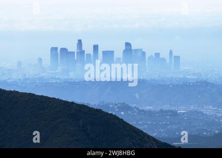 Storm haze and fog obscuring downtown Los Angeles skyline towers.  Photo taken on Mt Josephine in the Angeles National Forest. Stock Photo