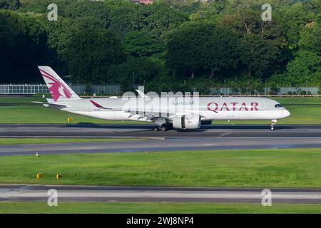 Qatar Airways Airbus A350 airplane landing. Plane A350XWB model of QatarAirways airline A7-AMF. Aircraft of Qatar Airways A350-900. Stock Photo