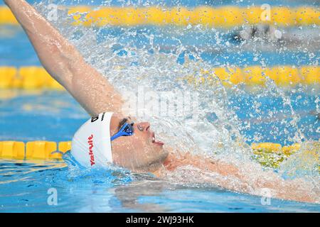 Doha, Qatar. 13th Feb, 2024. Apostolos Christou of Greece competes during the men's 100m backstroke final of swimming event at the World Aquatics Championships 2024 in Doha, Qatar, Feb. 13, 2024. Credit: Xue Yuge/Xinhua/Alamy Live News Stock Photo